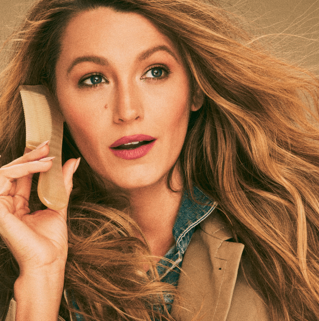 Image of Blake Lively holding a comb to her ear.