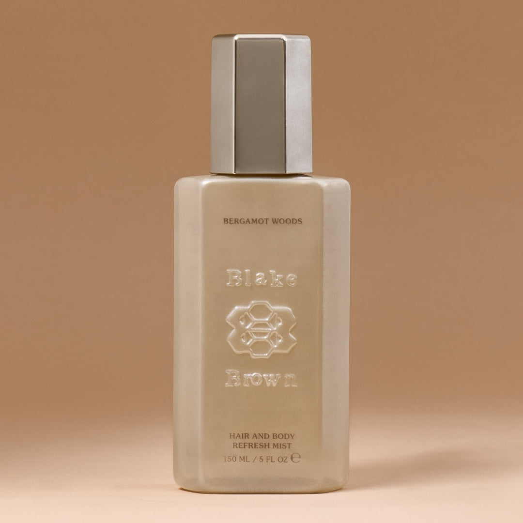 Blake Brown Bergamot Woods Hair and Body Refresh Mist against a neutral background.