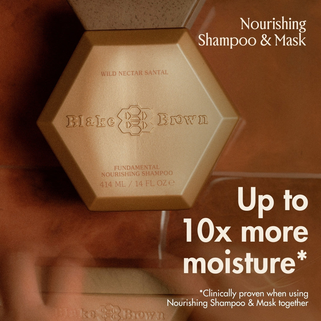 Blake Brown Fundamental Nourishing Shampoo in Wild Nectar Santal with text reading “Up to 10x more moisture” and “Nourishing Shampoo & Mask.”