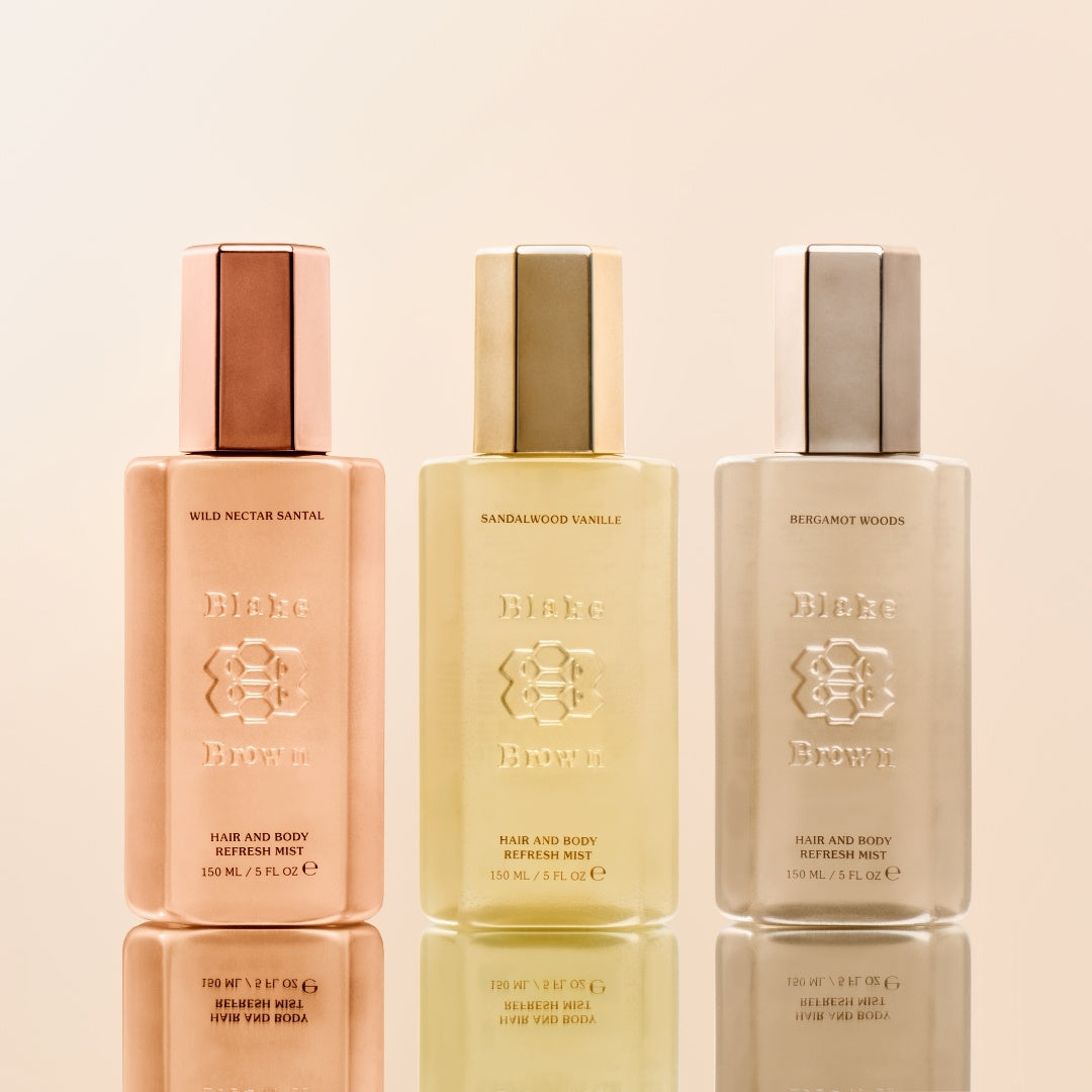 Blake Brown Hair and Body Refresh Mists in three signature scents—Wild Nectar Santal, Sandalwood Vanille, and Bergamot Woods—displayed side by side.