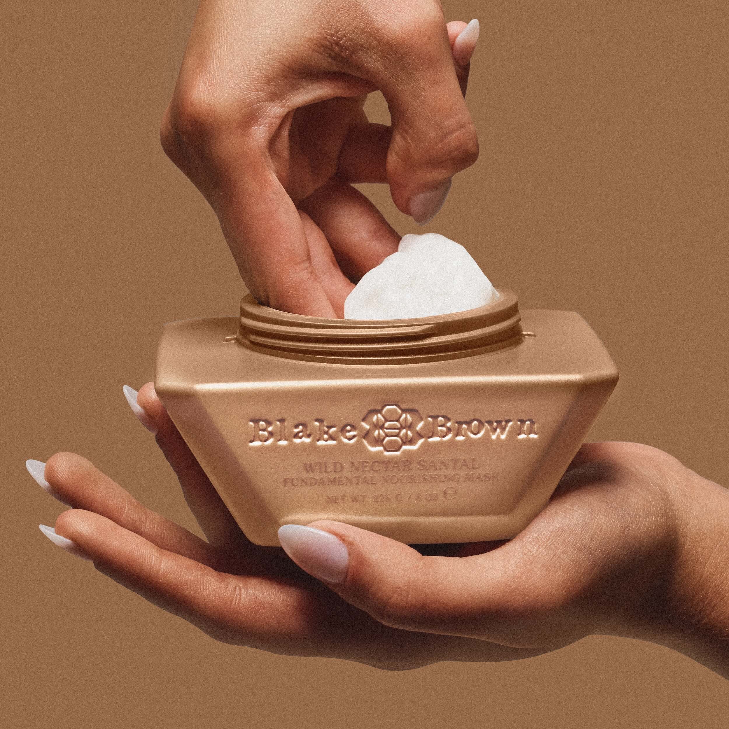 Open bottle of Blake Brown Wild Nectar Santal Fundamental Nourishing Hair Mask by Blake Lively, showing its creamy formulation.
