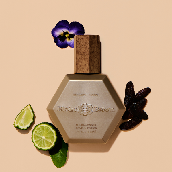 Blake Brown All-In-Wonder Leave-In Potion, styled with violet, tonka beans, and bergamot.