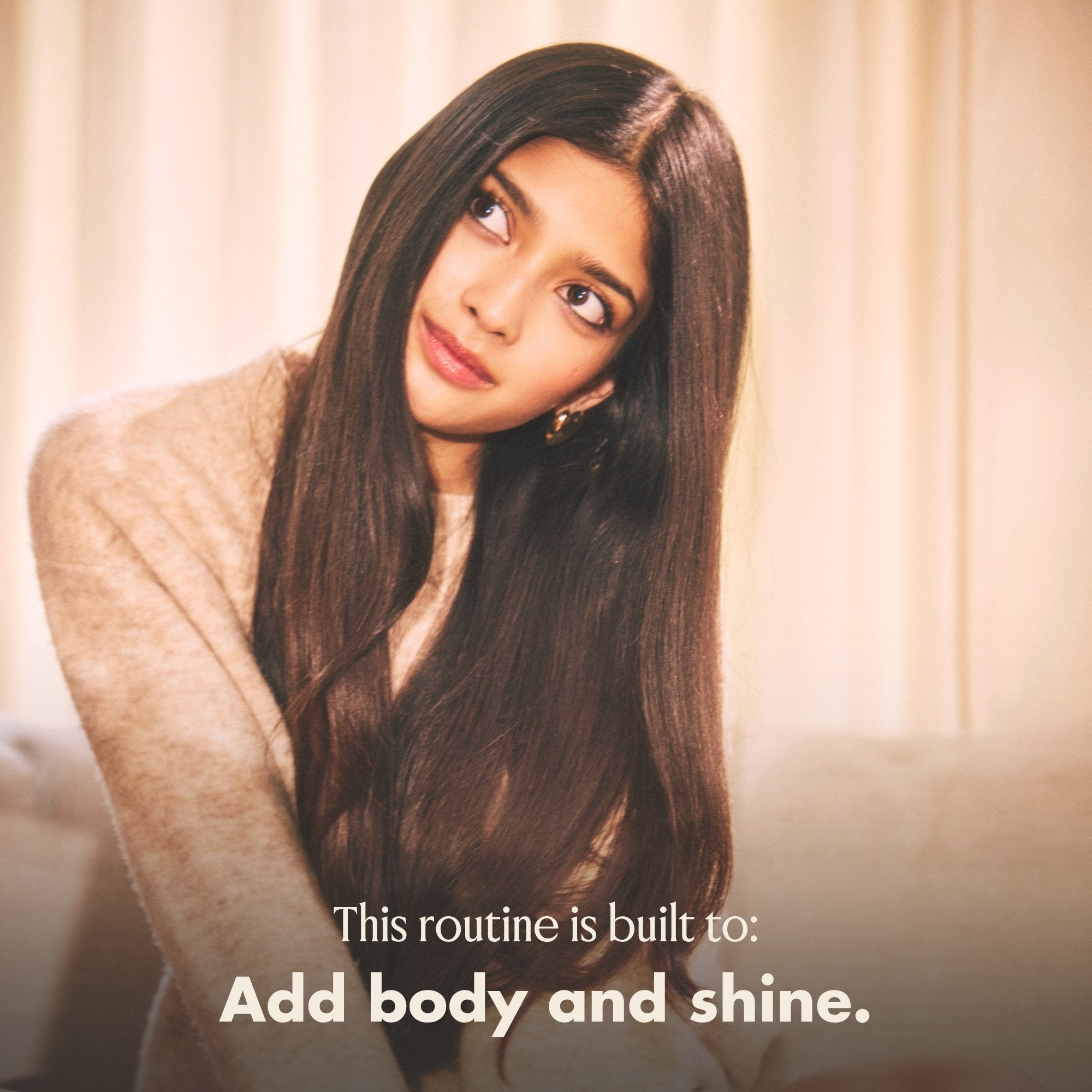 Blake Brown model with long dark hair and text that reads "This routine is built to add body and shine."